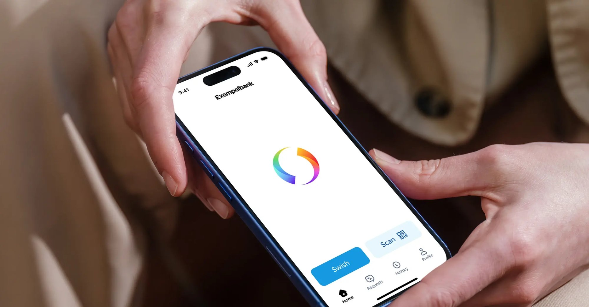Hands holding an iphone displaying the Swish app.
