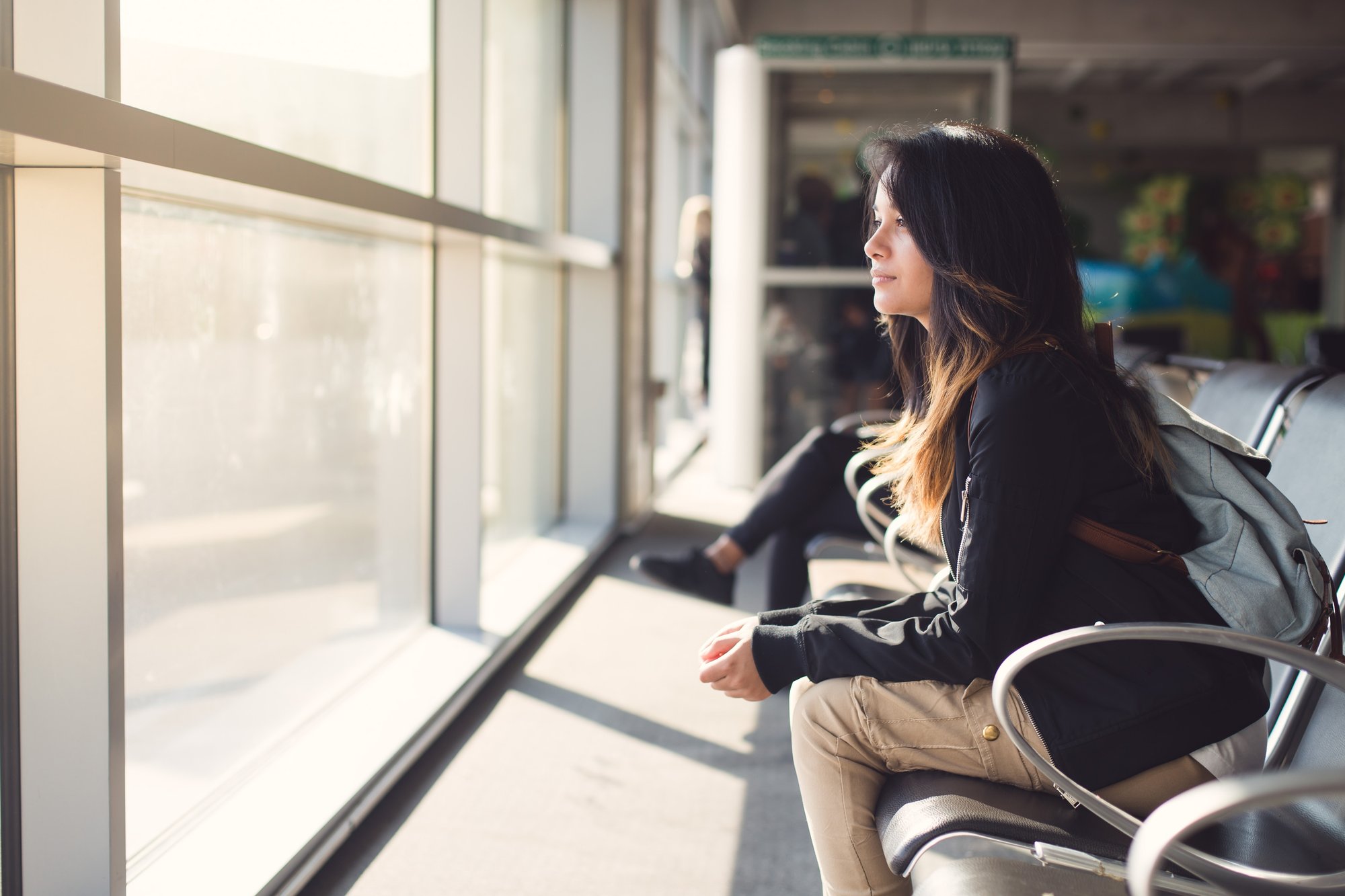 teenage-girl-waiting-at-airport-lounge